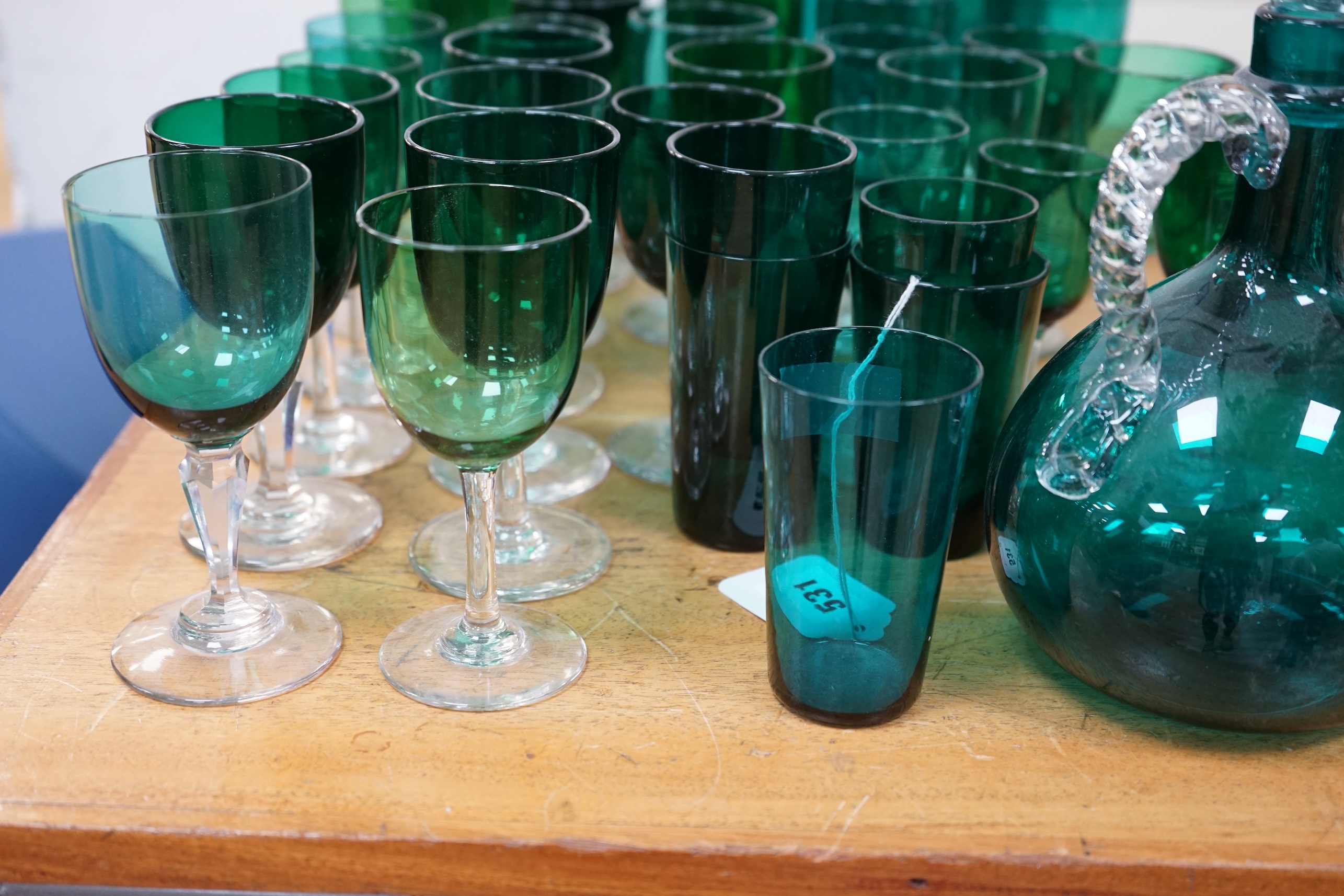 A collection of Victorian green glassware including a claret jug, 24cm. Condition - mostly good